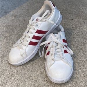 White Adidas sneakers with red stripe